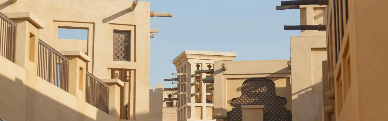 Embrace the blend of traditional and contemporary architectural styles in Dubai, showcasing unique building designs.