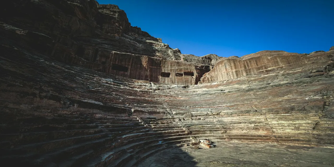 Captivating view of En-Nejr Theatre's ancient ruins in Petra, Jordan.