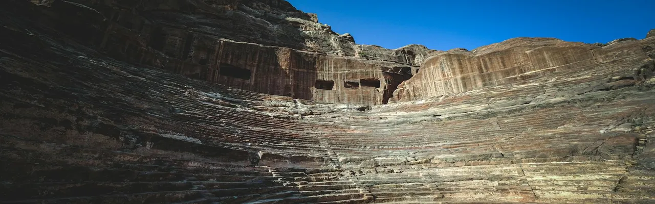Captivating view of En-Nejr Theatre's ancient ruins in Petra, Jordan.