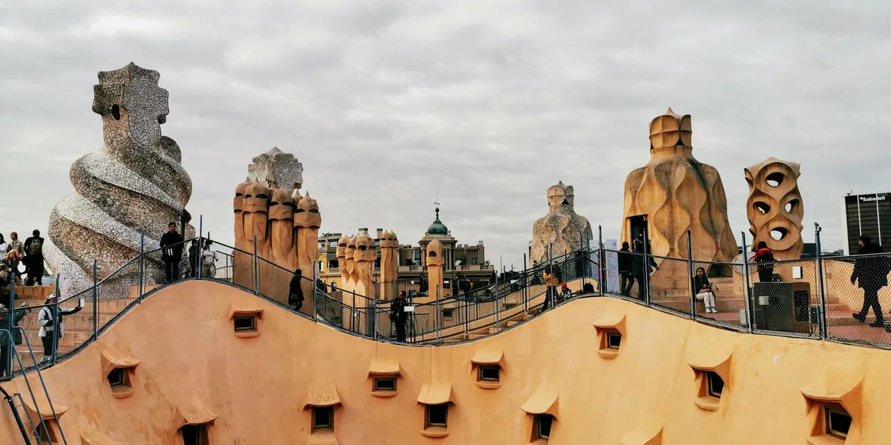 Explore the unique chimneys of Casa Mila rooftop in Barcelona, Spain.