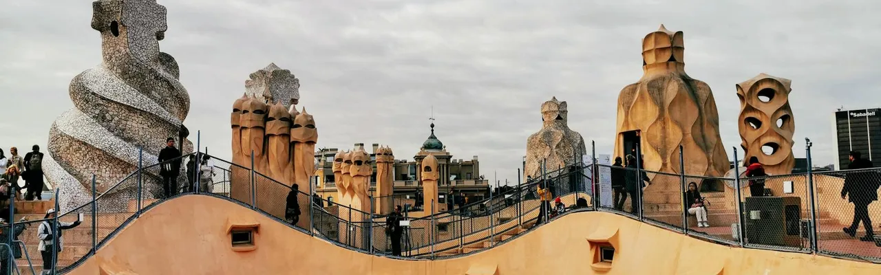 Explore the unique chimneys of Casa Mila rooftop in Barcelona, Spain.