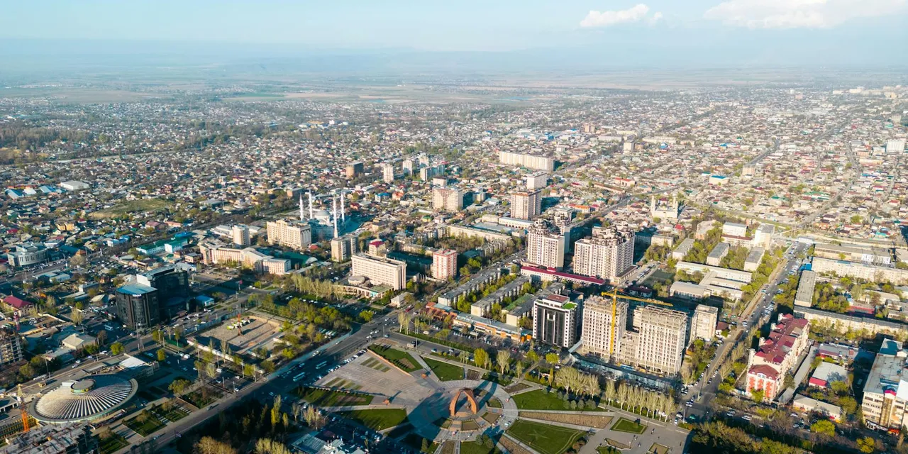 Stunning aerial view of Bishkek, Kyrgyzstan, showcasing its urban cityscape and local landmarks.