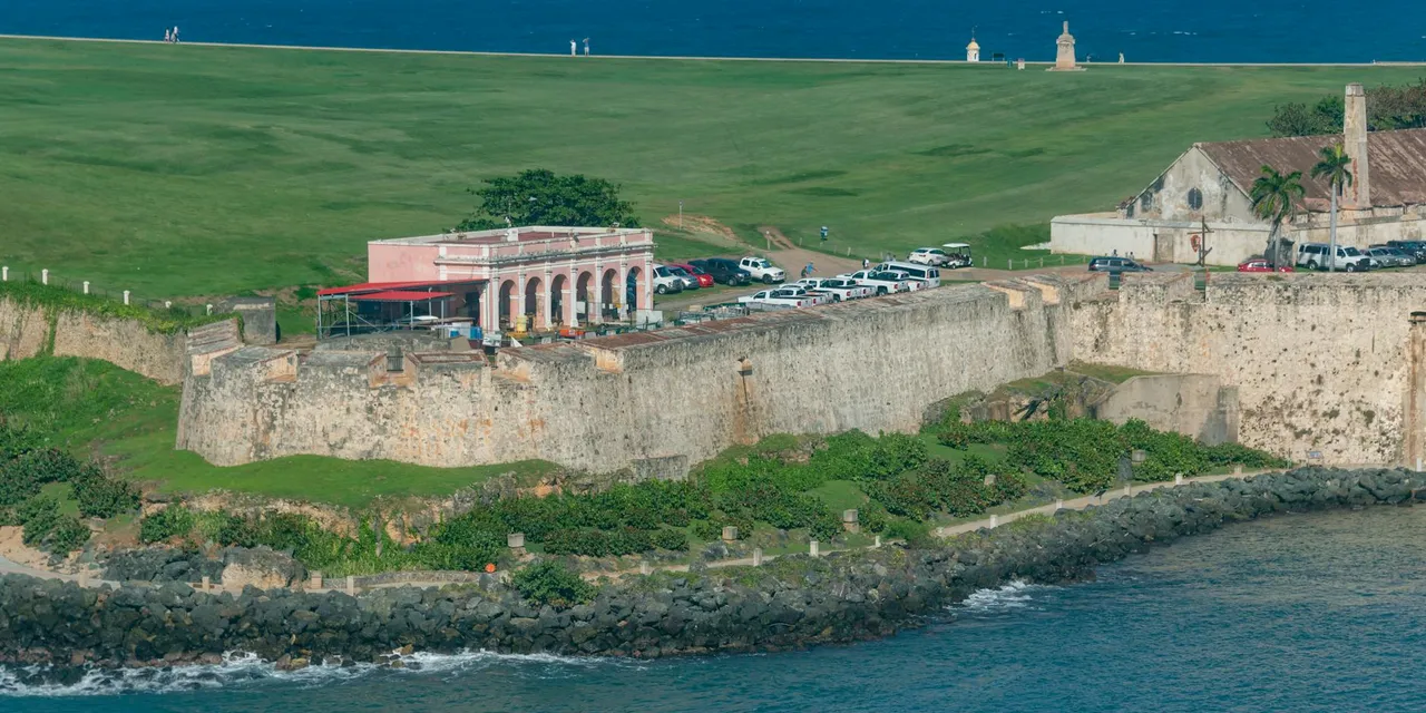 Aerial view of Castillo San Felipe del Morro by the sea, a landmark in Puerto Rico.