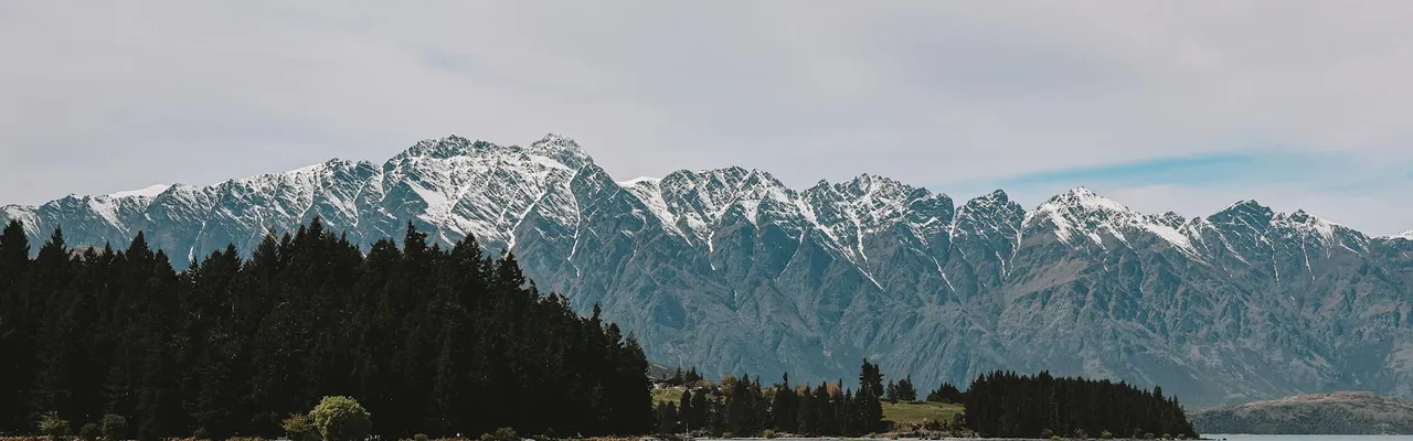 Experience the breathtaking scenery of Lake Wakatipu with the Remarkables mountain range in Queenstown, New Zealand.