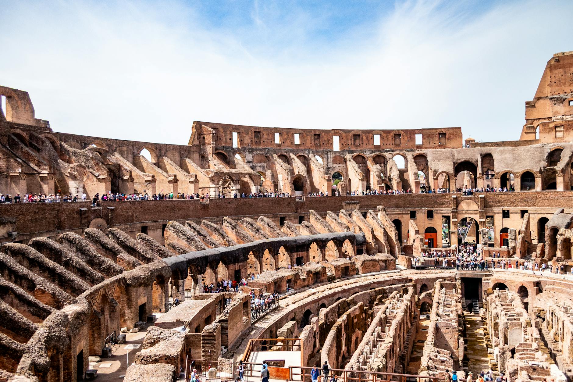 Explore the ancient architecture of the Roman Colosseum's interior, showcasing its historic beauty.