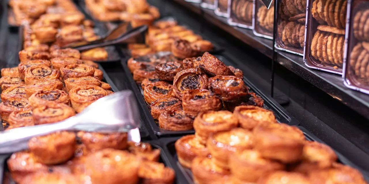 Crafted pastries and cookies on display in a Parisian bakery, evoking the charm of French culinary traditions.