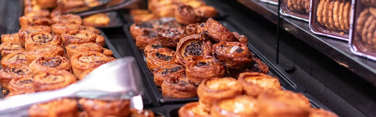 Crafted pastries and cookies on display in a Parisian bakery, evoking the charm of French culinary traditions.