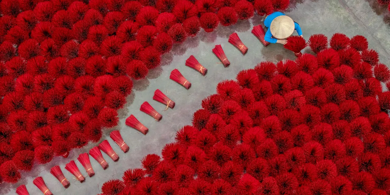 Stunning aerial shot of incense drying in Vietnam with vibrant colors and pattern.