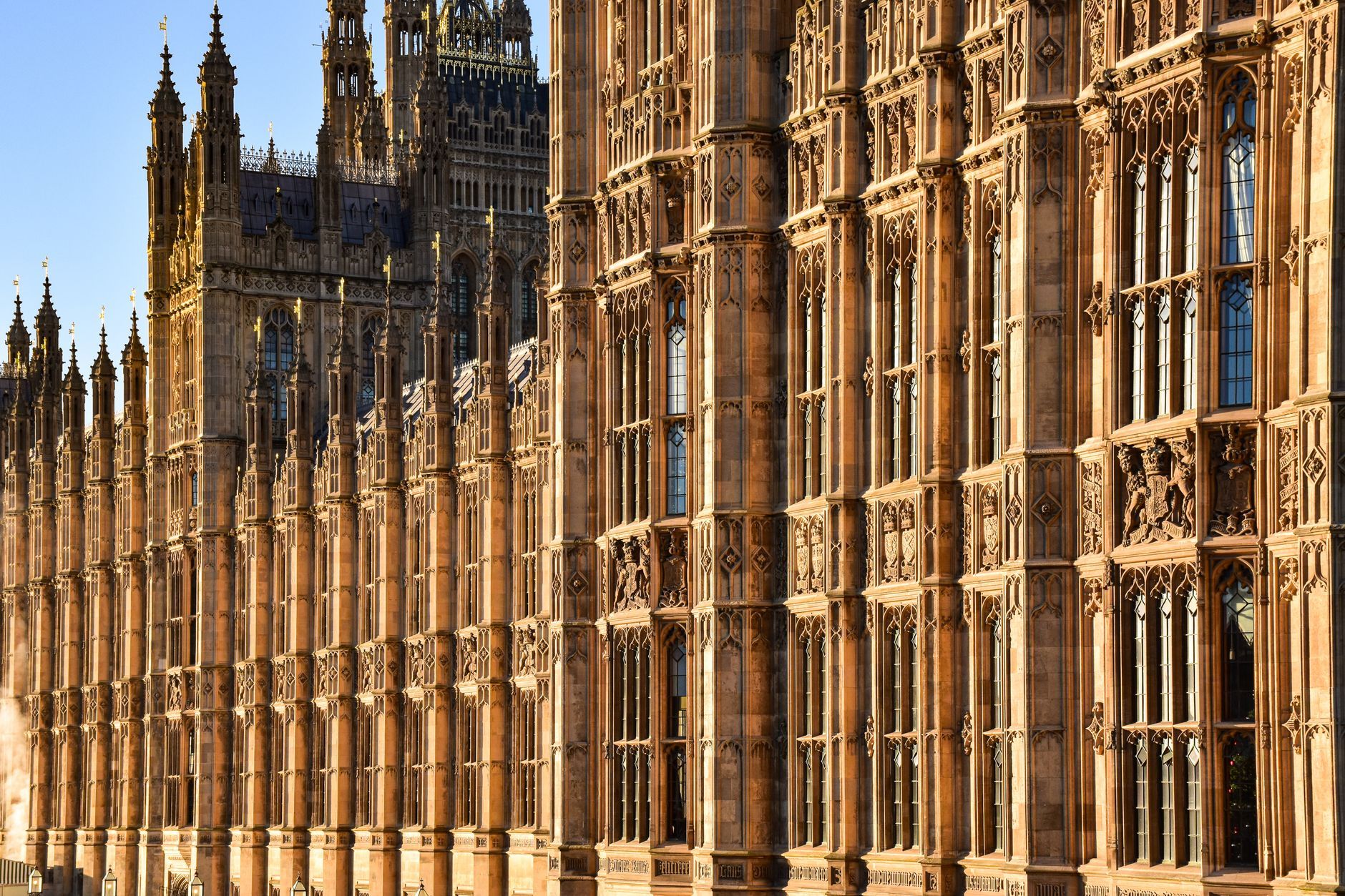 Close-up view of the ornate Gothic architecture of Westminster Palace, London, England.