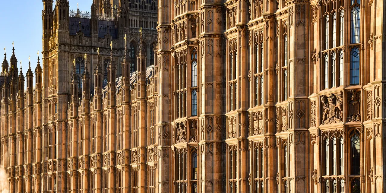 Close-up view of the ornate Gothic architecture of Westminster Palace, London, England.