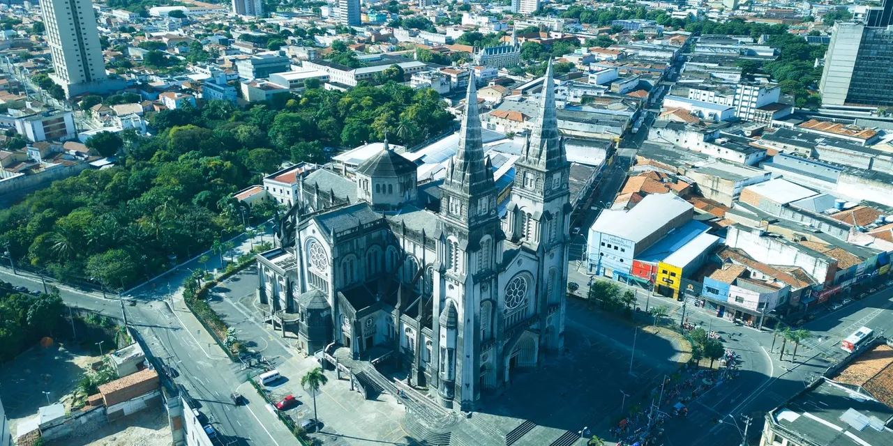 Stunning aerial view of the Metropolitan Cathedral amidst Fortaleza cityscape, Brazil.