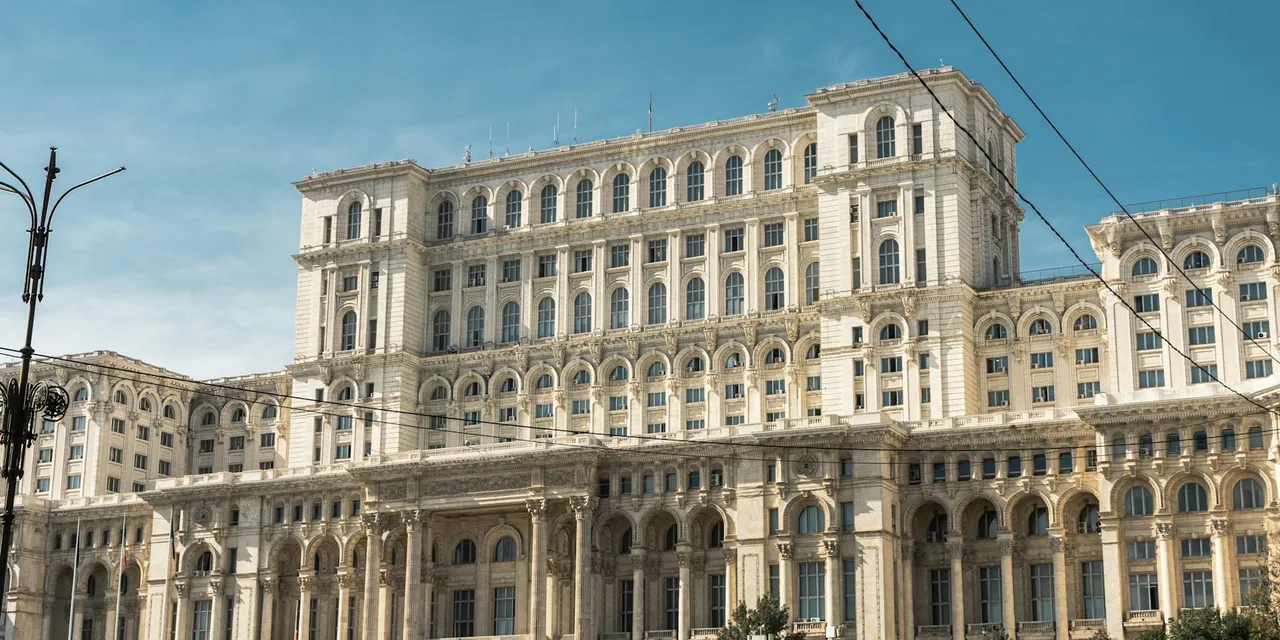 Capture of the iconic Palace of the Parliament in Bucharest, Romania under clear skies.