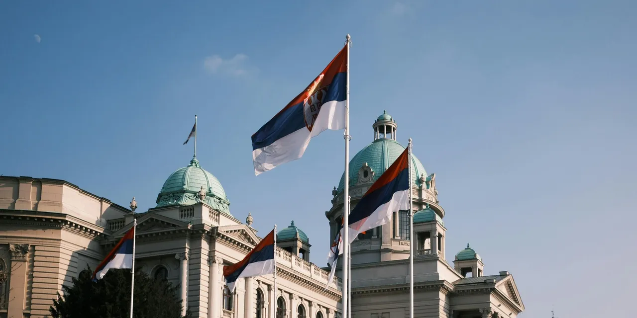 Serbian flags flying in front of the National Assembly building in Belgrade, Serbia
