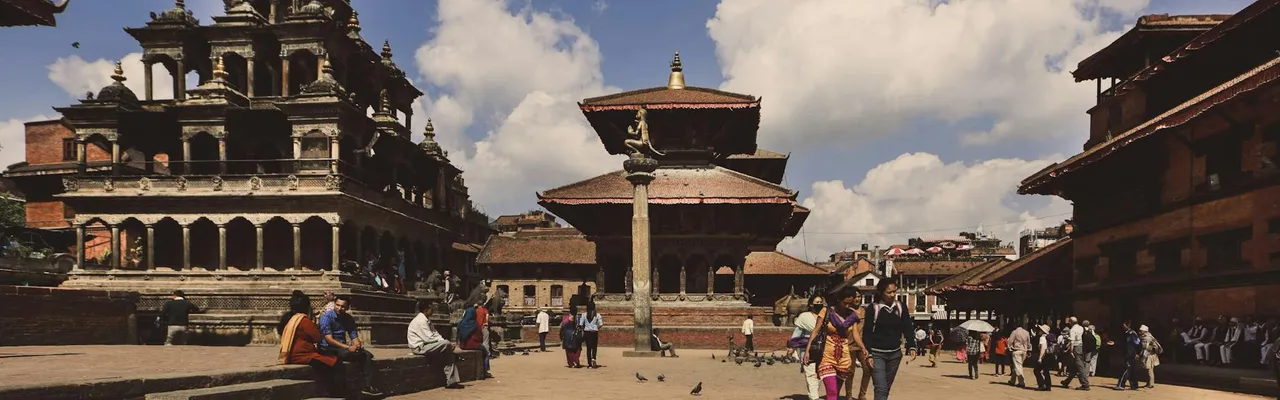 Explore the ancient architecture and vibrant life at Patan Durbar Square in Nepal.