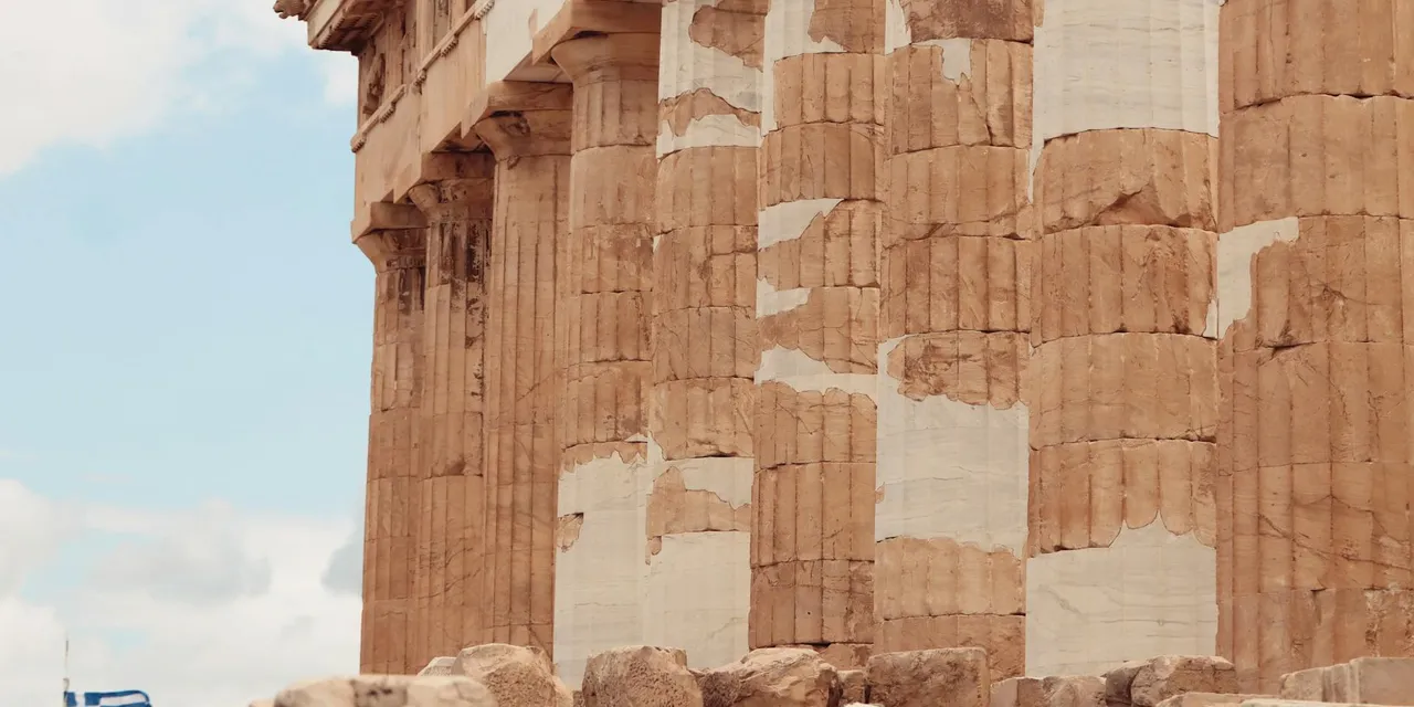 Detailed close-up of the Parthenon's ancient columns in Athens, Greece.