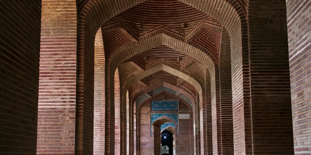 Intricate architecture and arches of the historic Shah Jahan Mosque in Makli, Sindh, Pakistan.