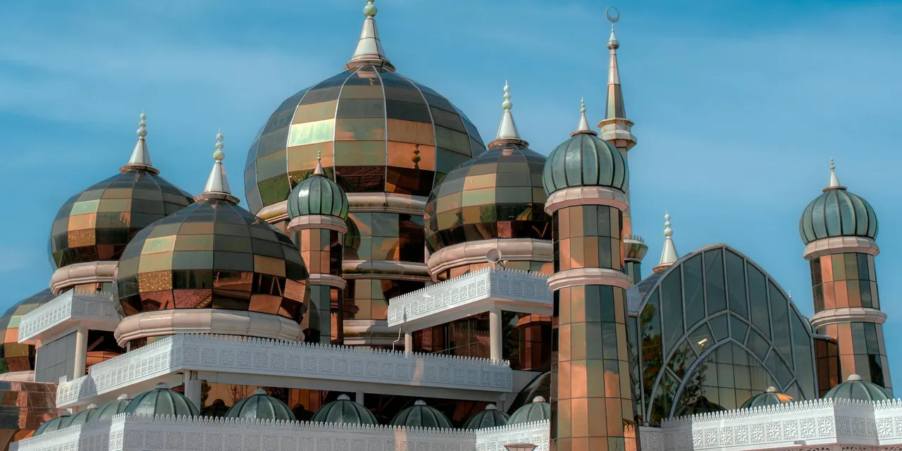 The renowned Crystal Mosque with its intricate domes in Malaysia.