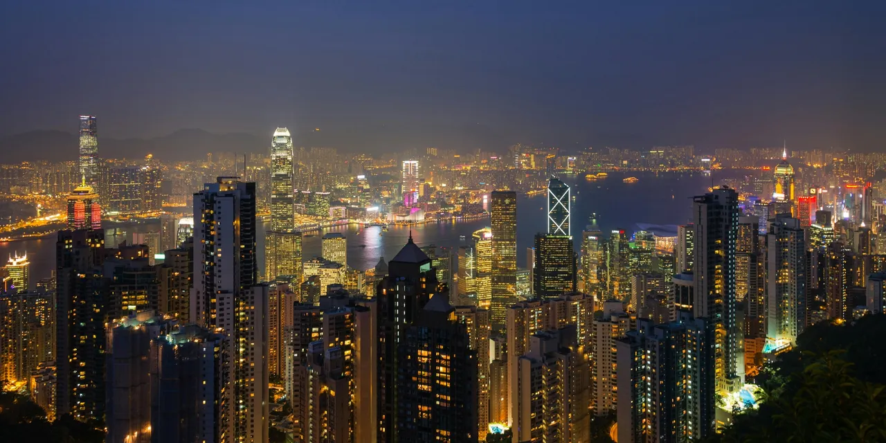 Hong Kong skyline at night from Victoria Peak with Victoria Harbour glowing below