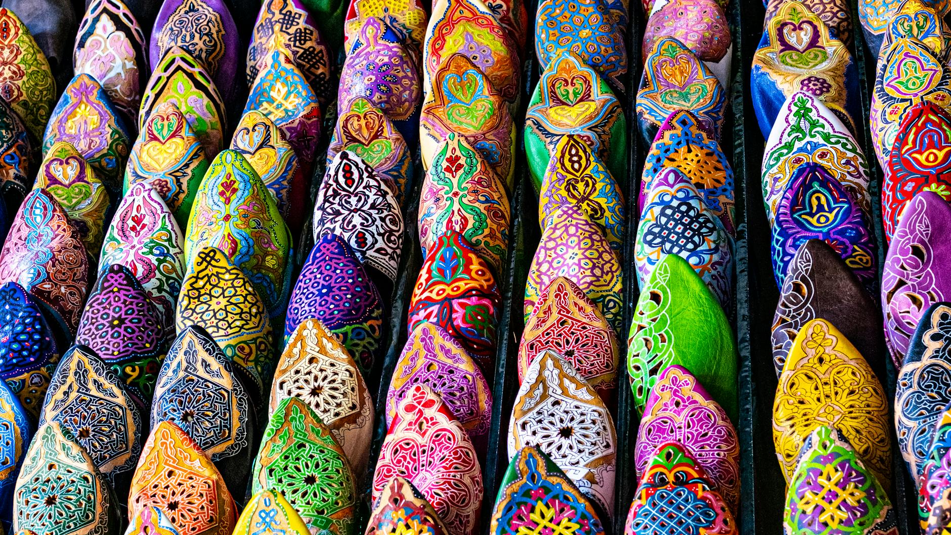 Vibrant handcrafted Moroccan slippers on display in Marrakesh, showcasing traditional artistry.