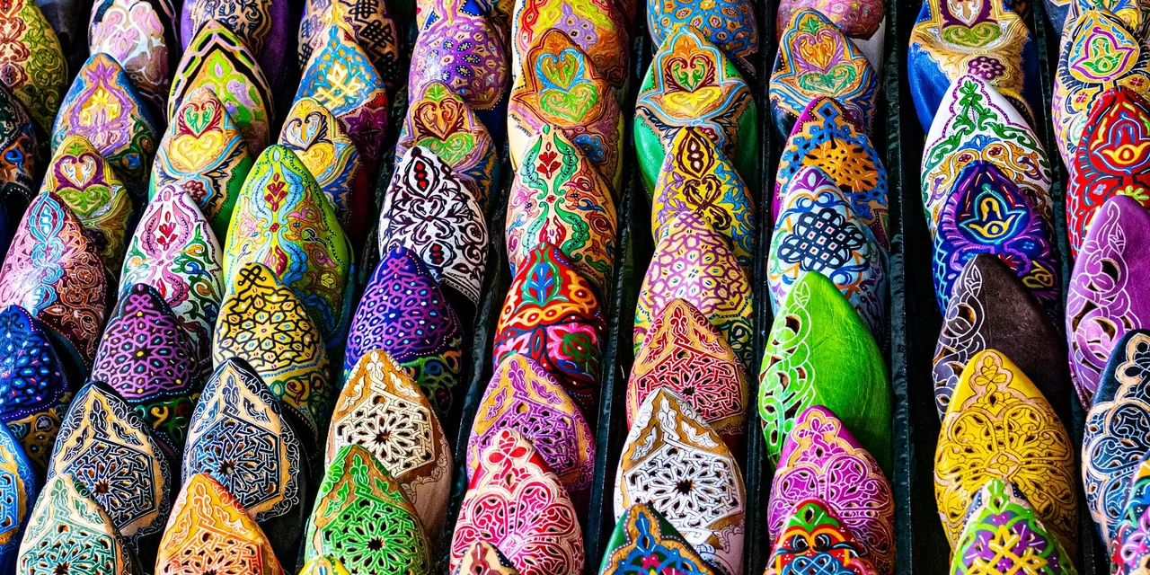 Vibrant handcrafted Moroccan slippers on display in Marrakesh, showcasing traditional artistry.