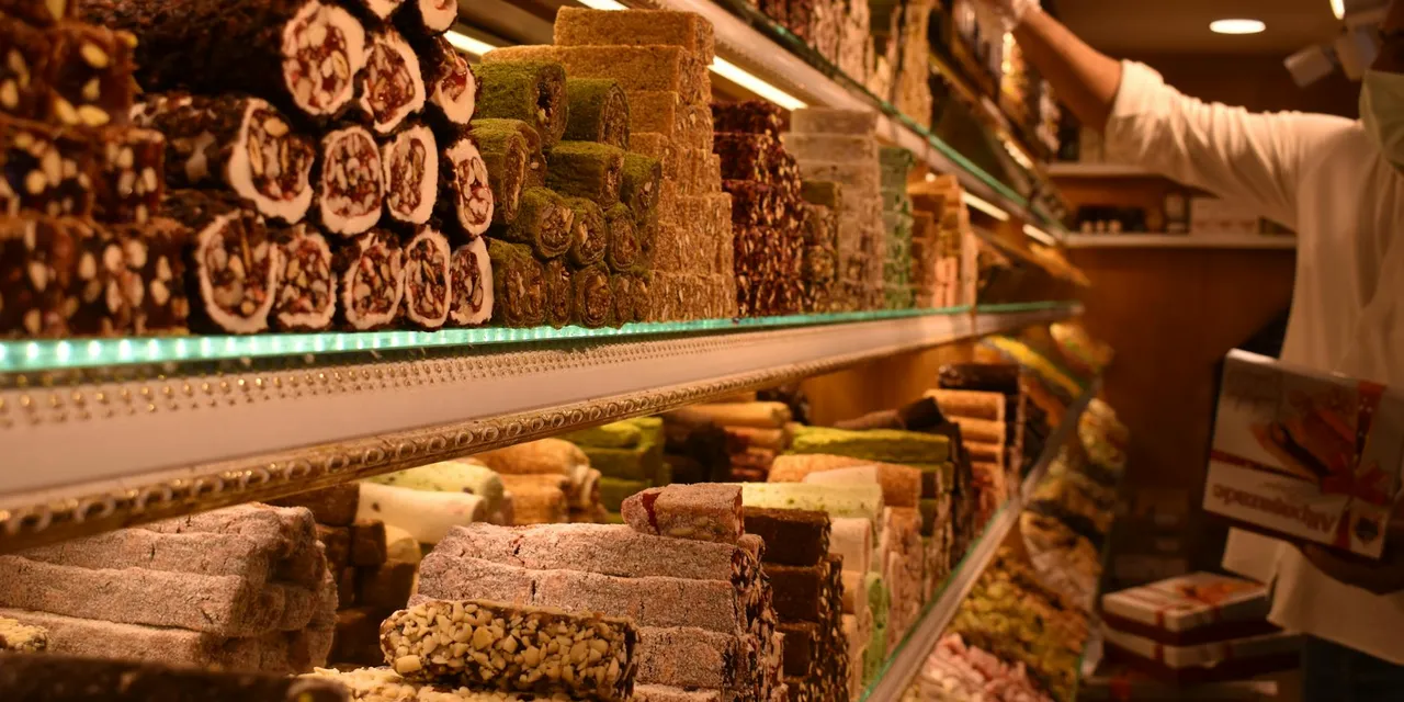 Explore shelves filled with colorful Turkish delights in a bustling Istanbul market.