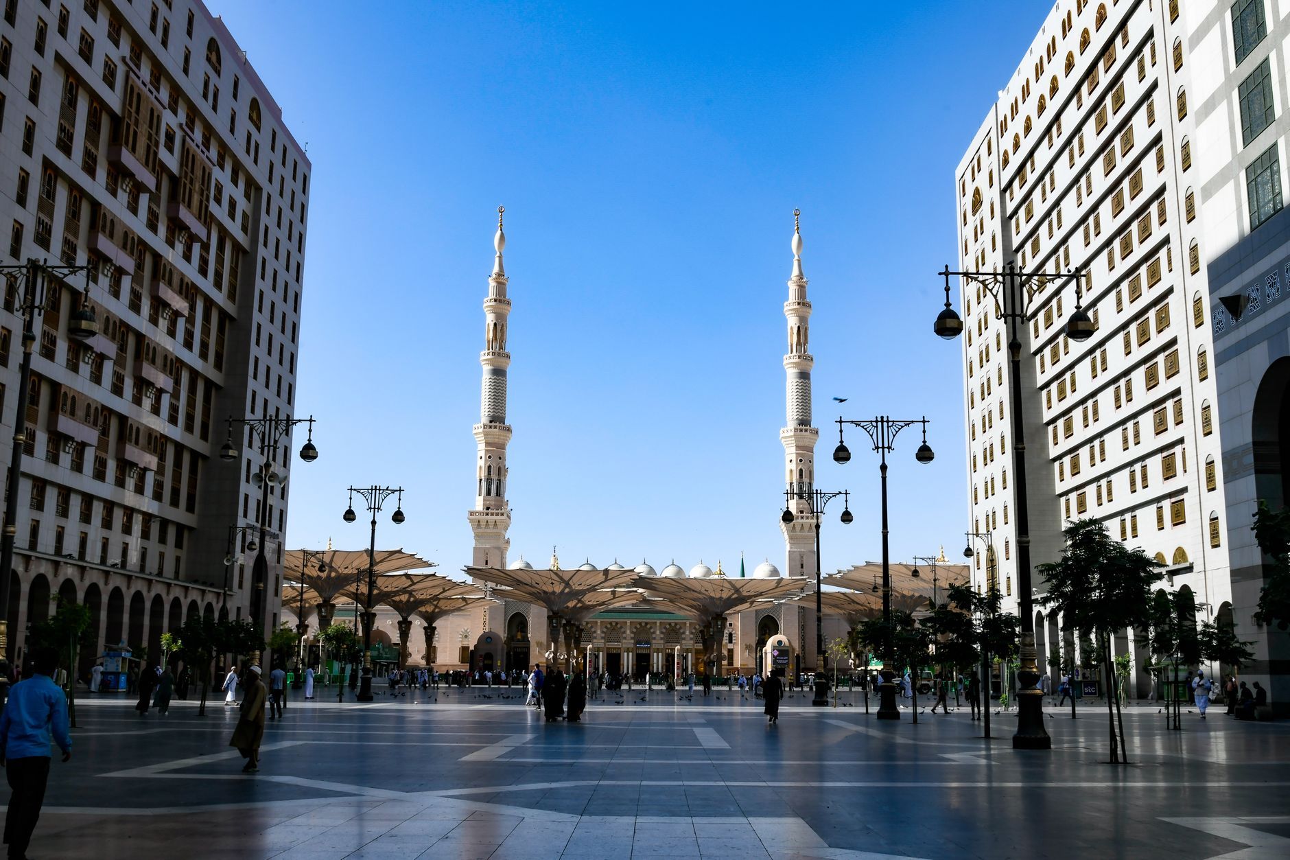 The stunning architecture of Al-Masjid an-Nabawi mosque with its iconic minarets in Medina, Saudi Arabia.