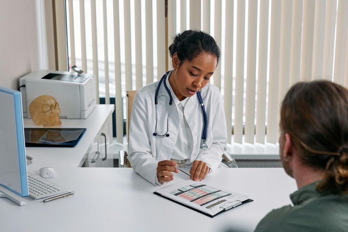 Doctor with IBD patient before travelling abroad