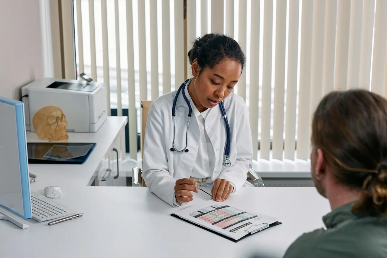 Doctor with IBD patient before travelling abroad