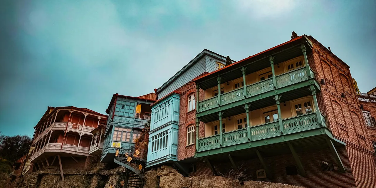 Explore the vintage charm of colorful wooden balconies on historic buildings in Tbilisi, Georgia.