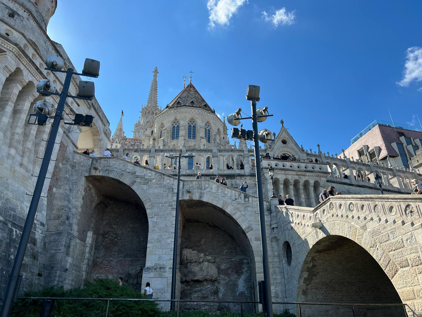Fisherman's Bastion in Budapest, Hungary, photographed in daylight with a clear blue sky.
