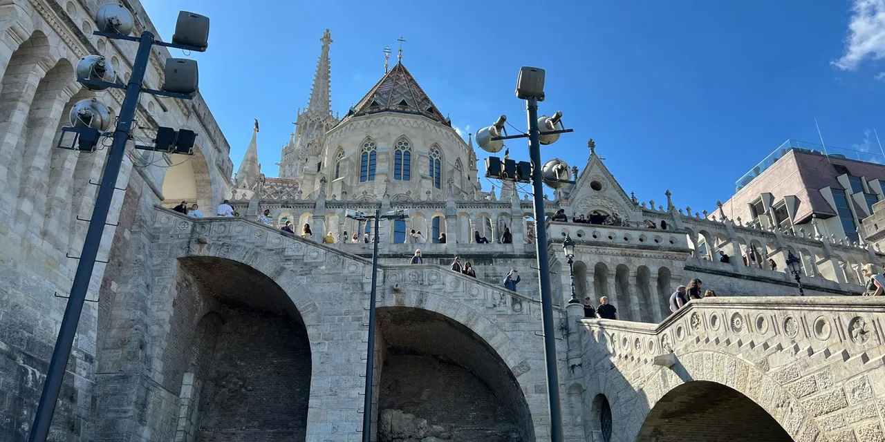 Fisherman's Bastion in Budapest, Hungary, photographed in daylight with a clear blue sky.