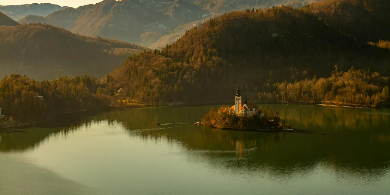 A serene view of Lake Bled in Slovenia with its picturesque church on an island.