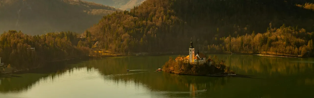 A serene view of Lake Bled in Slovenia with its picturesque church on an island.