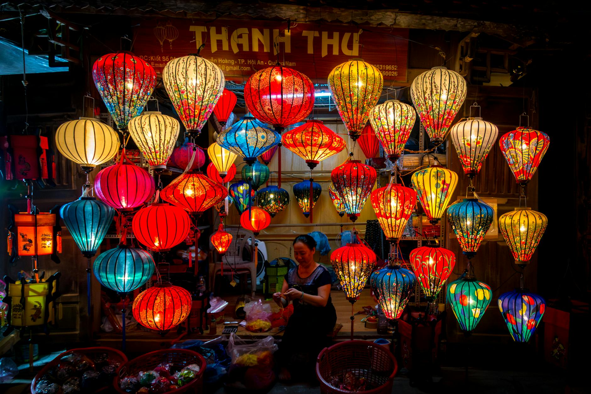Vibrant silk lanterns hanging in a Hanoi night market, showcasing traditional Vietnamese craftsmanship.