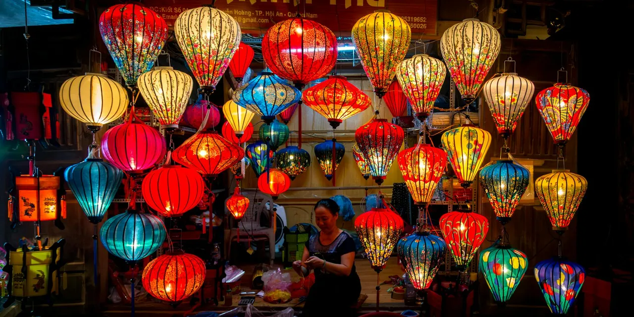 Vibrant silk lanterns hanging in a Hanoi night market, showcasing traditional Vietnamese craftsmanship.