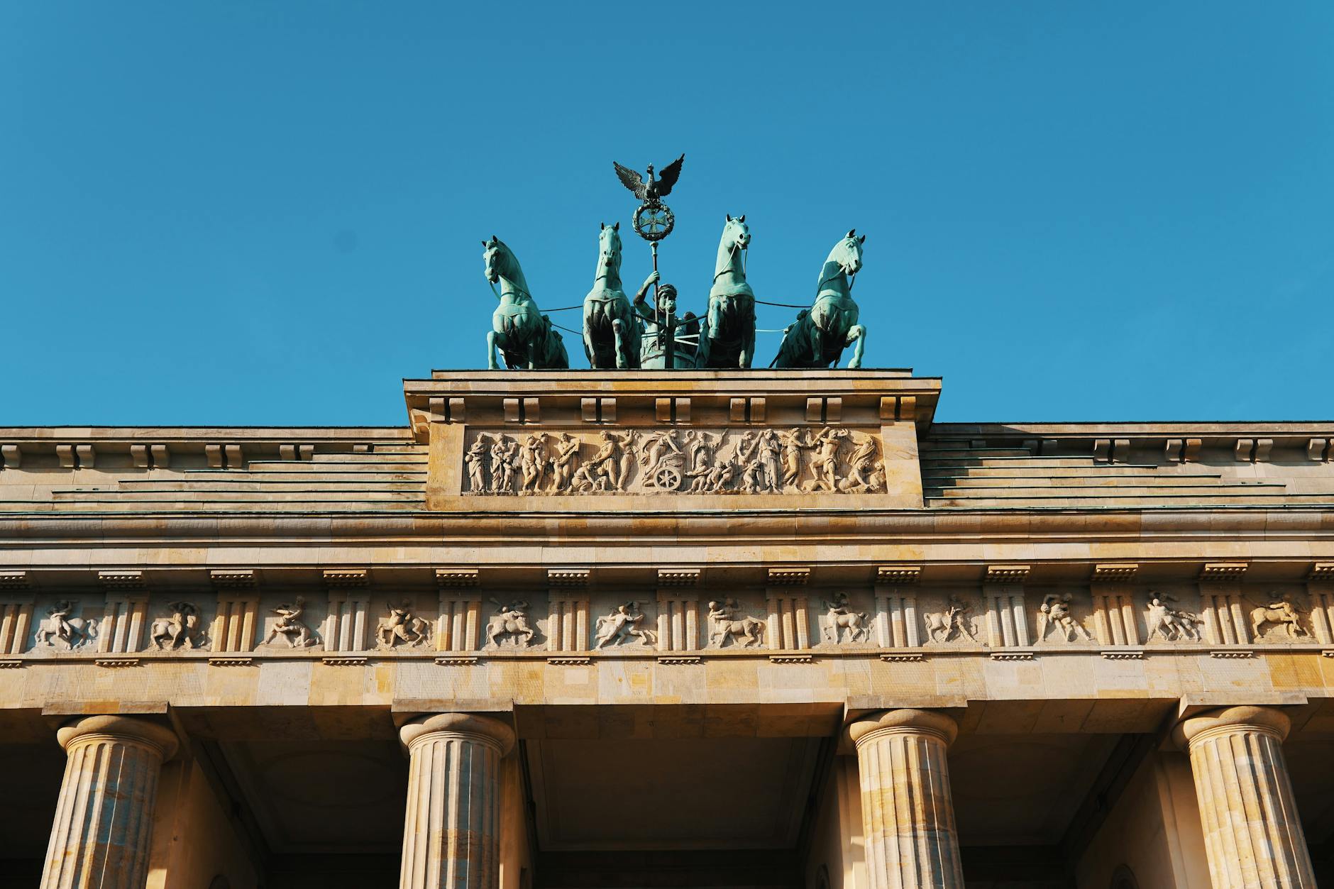 Close-up of the iconic Brandenburg Gate's architecture and sculptures in Berlin, Germany.