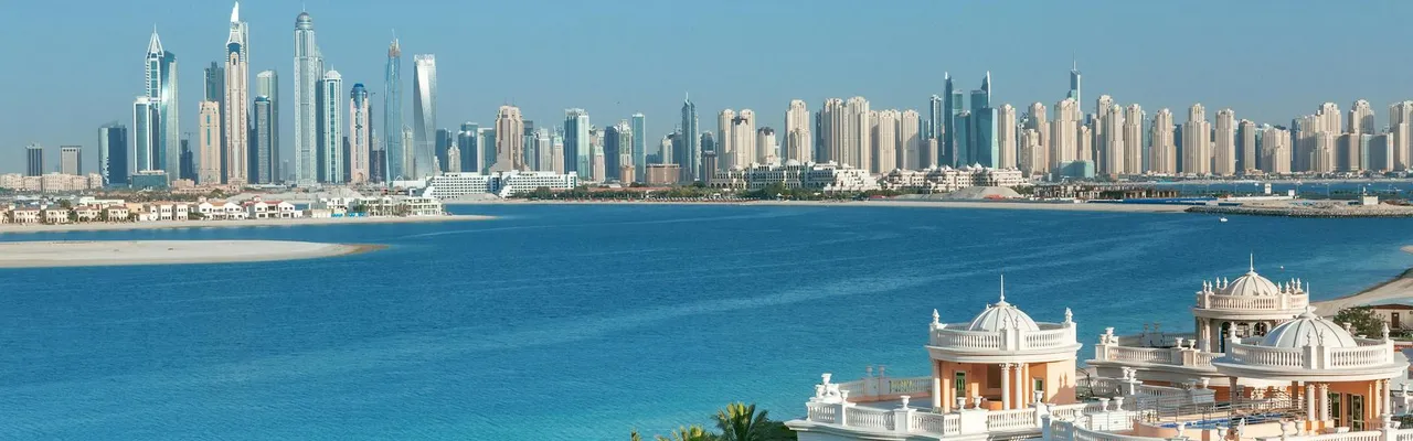 Breathtaking view of Dubai skyline and Palm Jumeirah, showcasing luxury beachfront architecture.