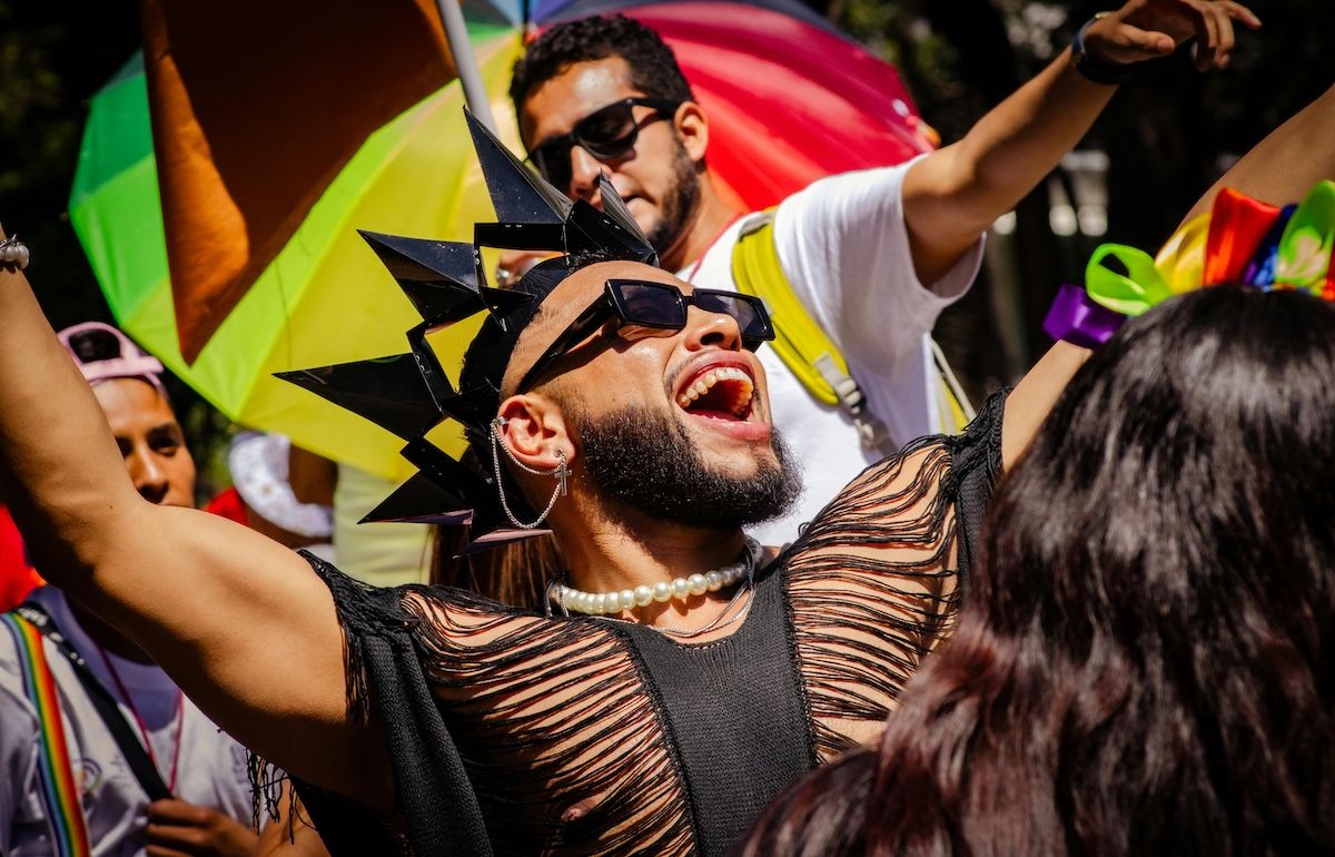 Gay male digital nomad celebrating Barcelona Pride, Spain