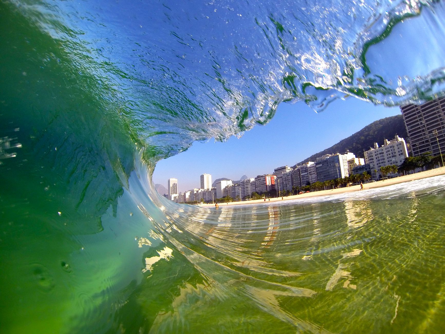 Dynamic view of a wave at Copacabana Beach, capturing the vibrant energy of Rio de Janeiro's coast.