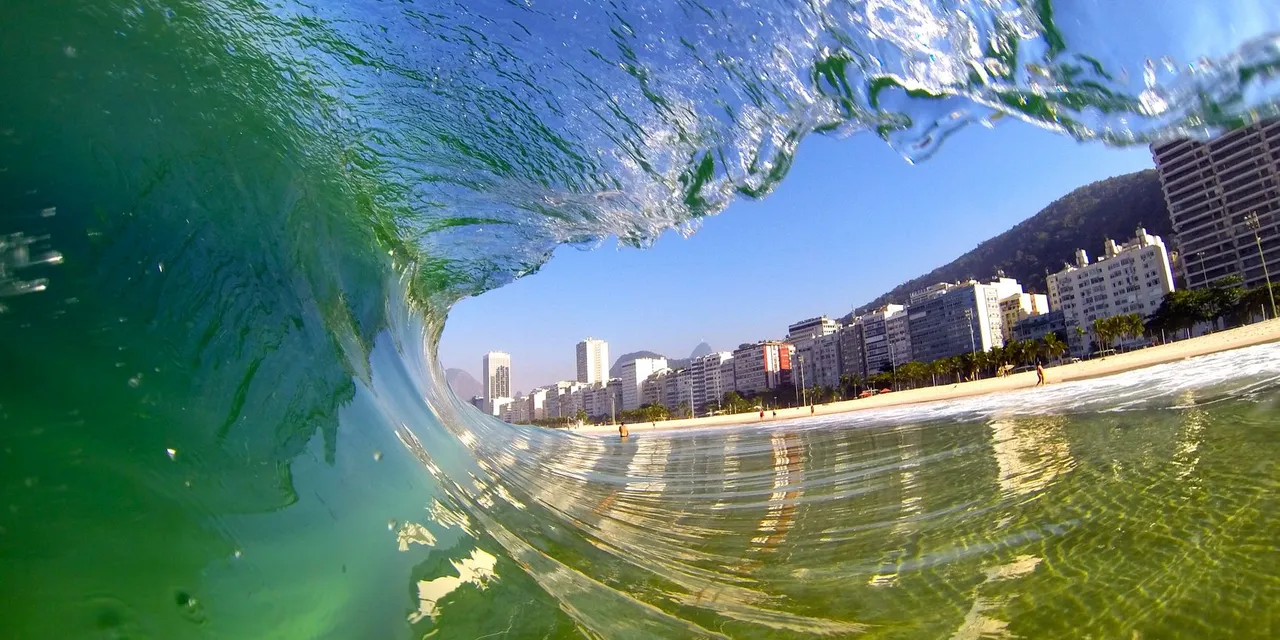 Dynamic view of a wave at Copacabana Beach, capturing the vibrant energy of Rio de Janeiro's coast.