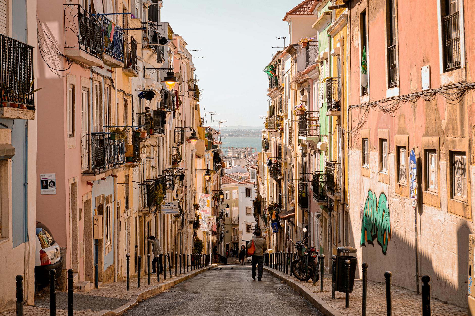 Colorful architecture and cobblestone streets in a charming Lisbon neighborhood.