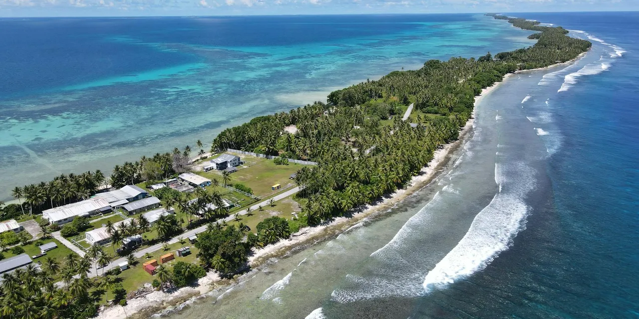 Aerial view of the tropical coastline and crystal-clear ocean at Majuro Atoll, Marshall Islands.