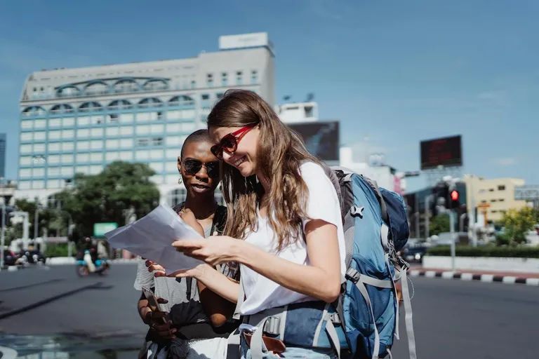 Women with ADHD travelling to Thailand reading map