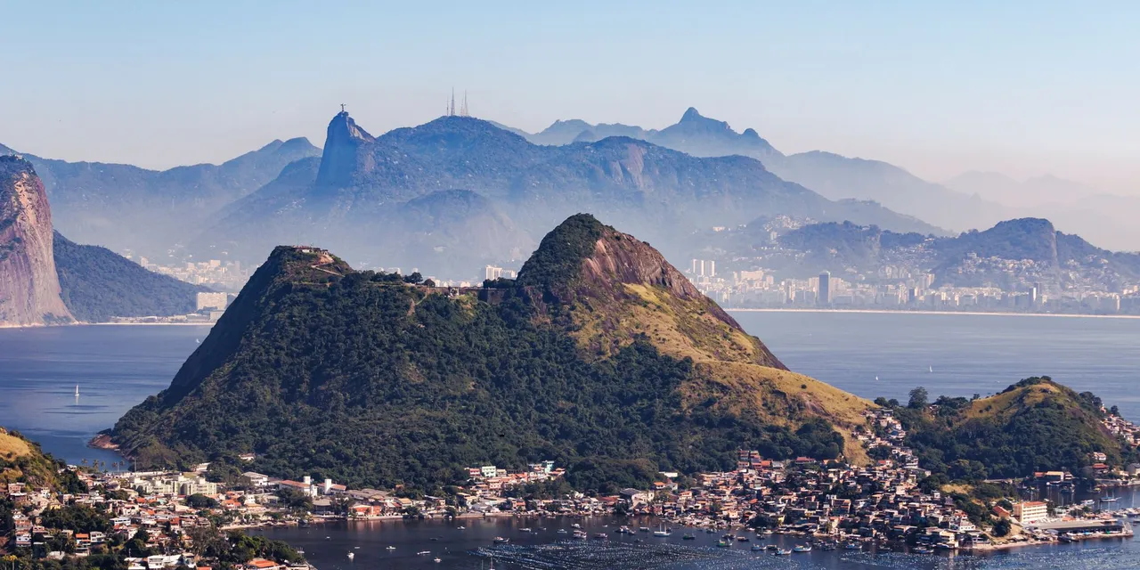 Stunning aerial view of Niterói, Brazil with Sugarloaf Mountain and scenic coastlines.