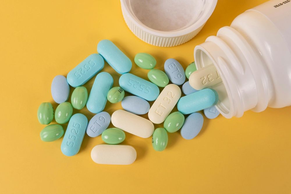 Multicoloured pills including HIV medication and Prep for when travelling abroad