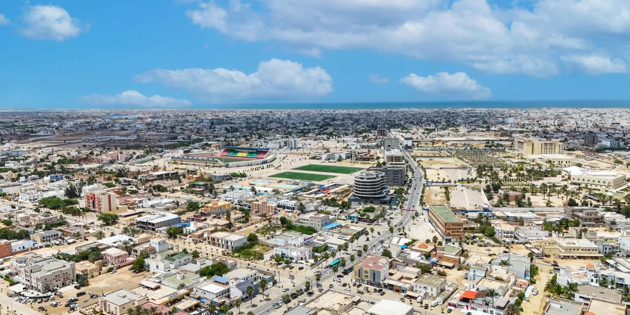 Stunning aerial shot of Nouakchott, Mauritania, showcasing urban sprawl under a bright blue sky.