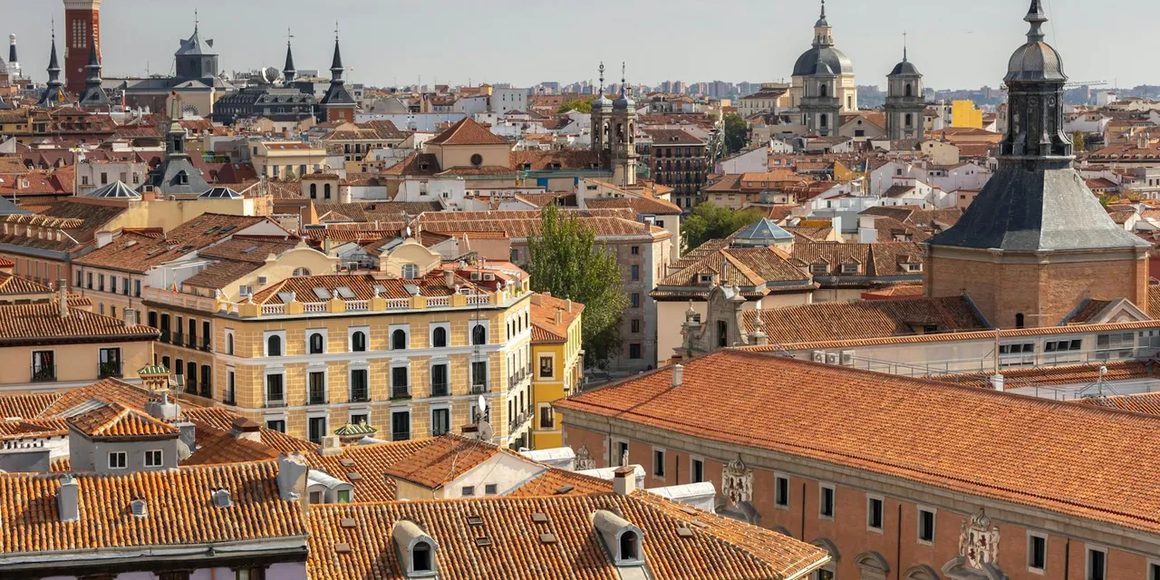 A captivating aerial view of Madrid's historic rooftops with iconic architectural landmarks.