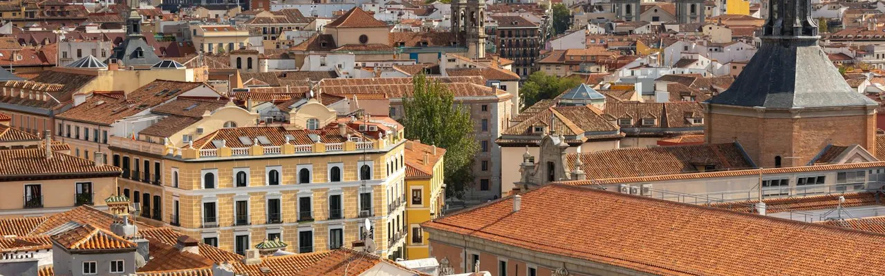 A captivating aerial view of Madrid's historic rooftops with iconic architectural landmarks.