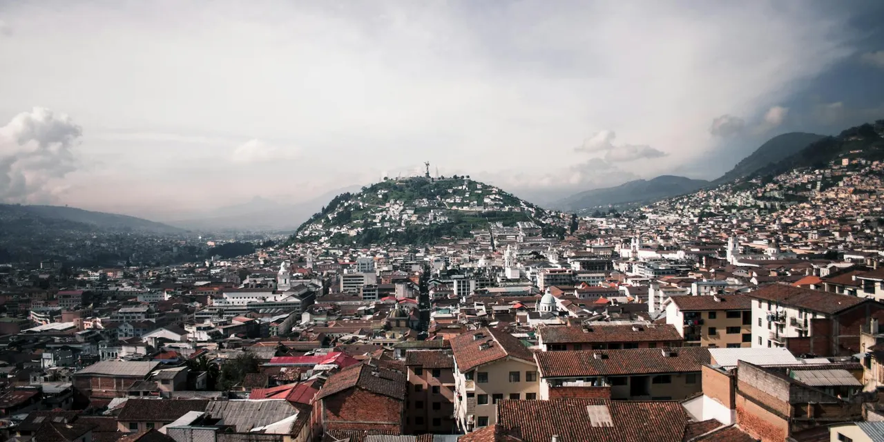 A stunning aerial view capturing the vibrant urban landscape and mountains of Quito, Ecuador.