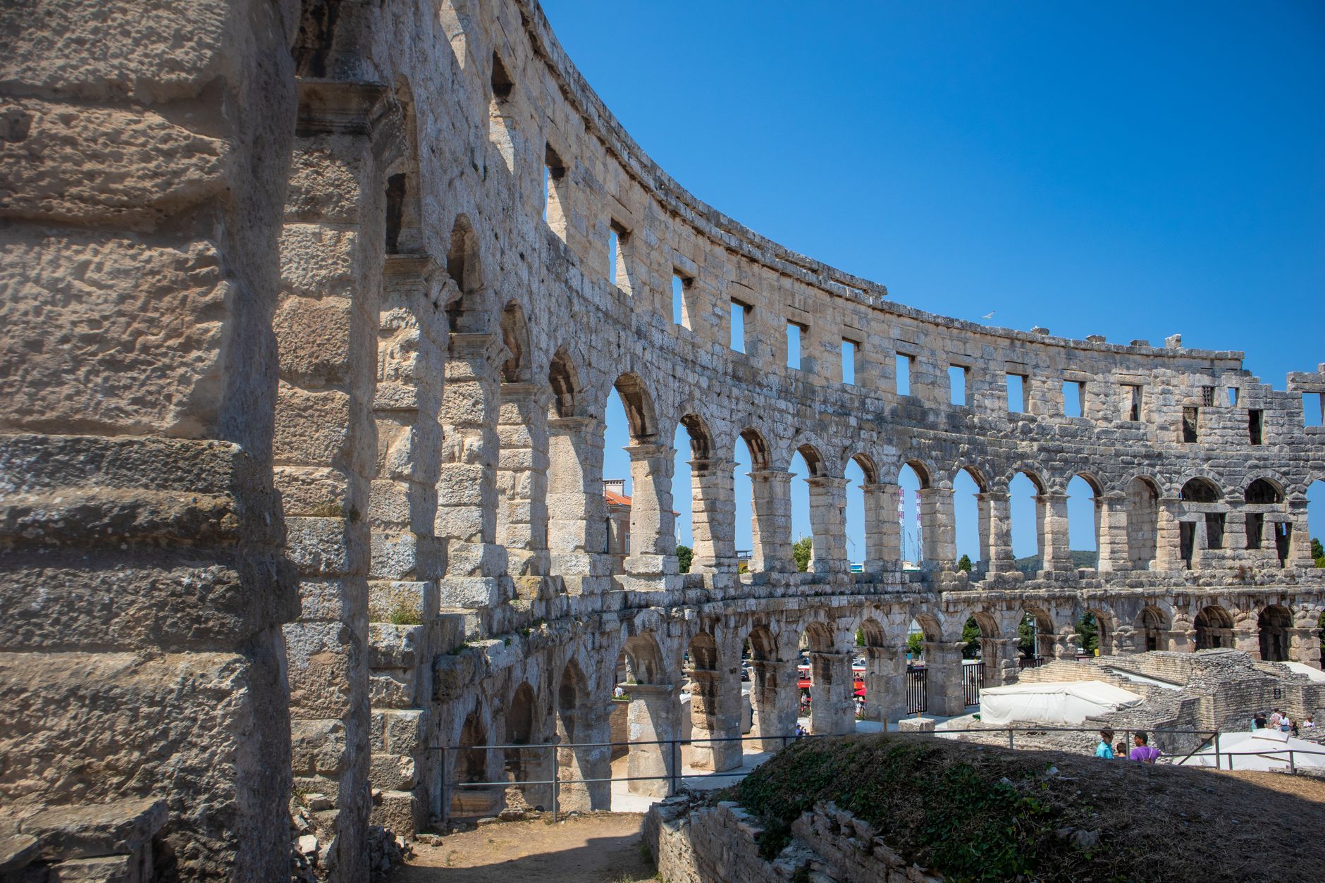 Explore the historic Roman amphitheatre ruins in Poreč, Croatia, showcasing ancient architecture.